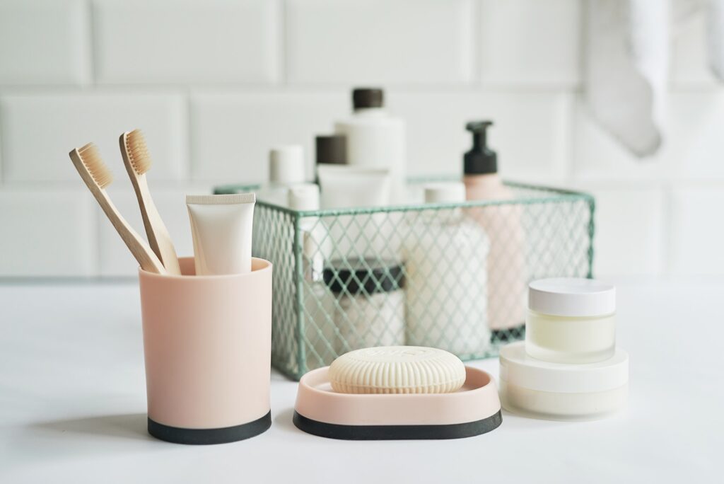 Bath accessories. Cosmetics, hygiene products. Spa, beauty salon. Toothbrush, soap, cream containers