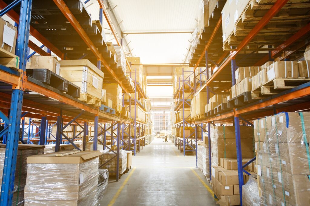 Mockup of modern warehouse with shelves of goods with Copy space